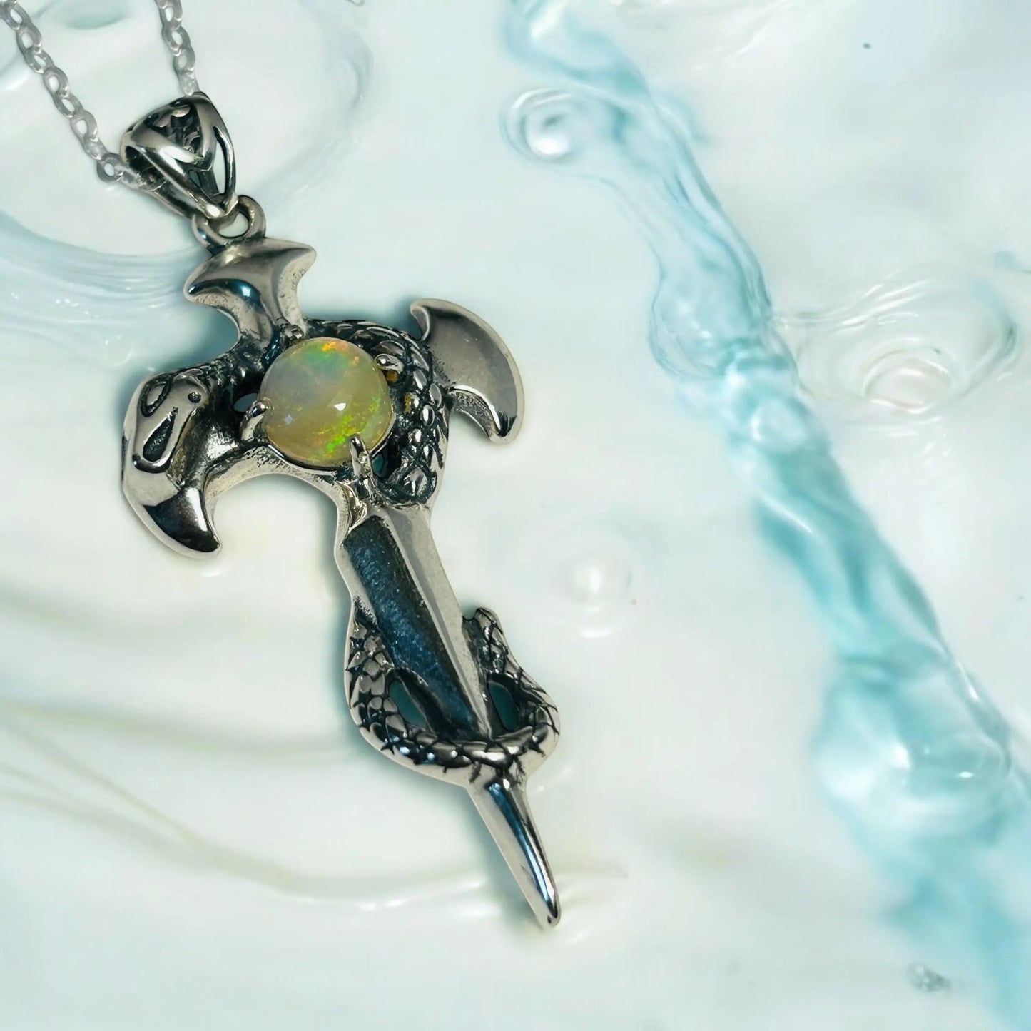 Celtic Dragon Jewellery sterling silver snake on sword pendant with rainbow opal gemstone, 925 silver.