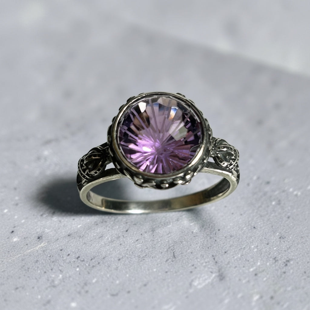Celtic Dragon Jewellery adjustable silver ring with a 9mm checkerboard amethyst stone and ornate crown details.