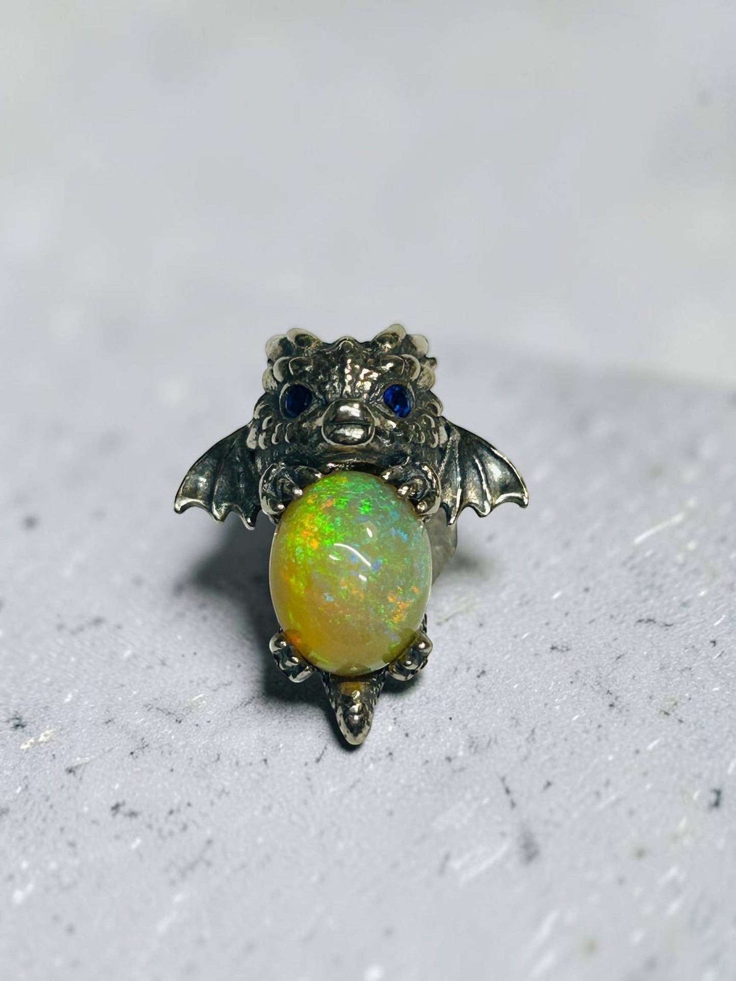 Celtic Dragon Jewellery Sterling Silver Baby Dragon Pendant with vibrant opal and blue CZ eyes.