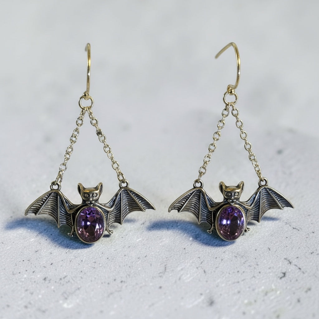 Celtic Dragon Jewellery pair of 925 silver dangle bat earrings with faceted amethyst gemstones, 38mm tall.