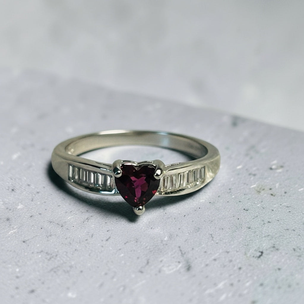 Celtic Dragon Jewellery adjustable silver ring with heart-shaped garnet and baguette CZ stones.