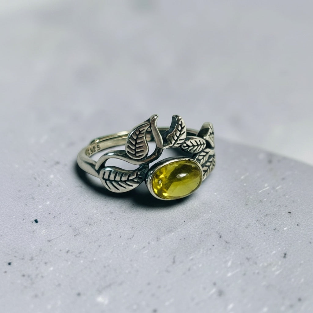 Celtic Dragon Jewellery adjustable sterling silver ring with golden prehnite gemstone and vine leaf design.
