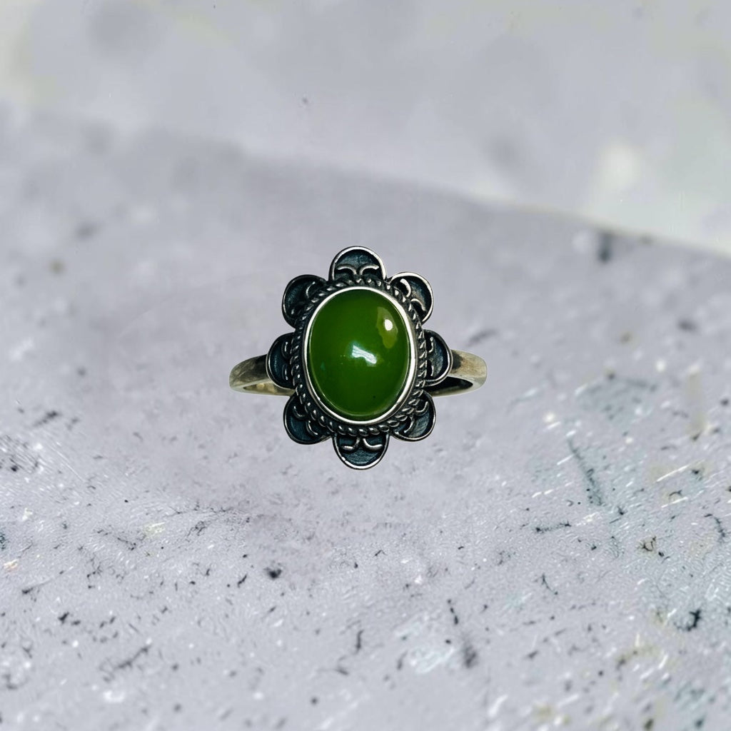 Celtic Dragon Jewellery adjustable 925 silver ring with a green jade gemstone and floral petal design.