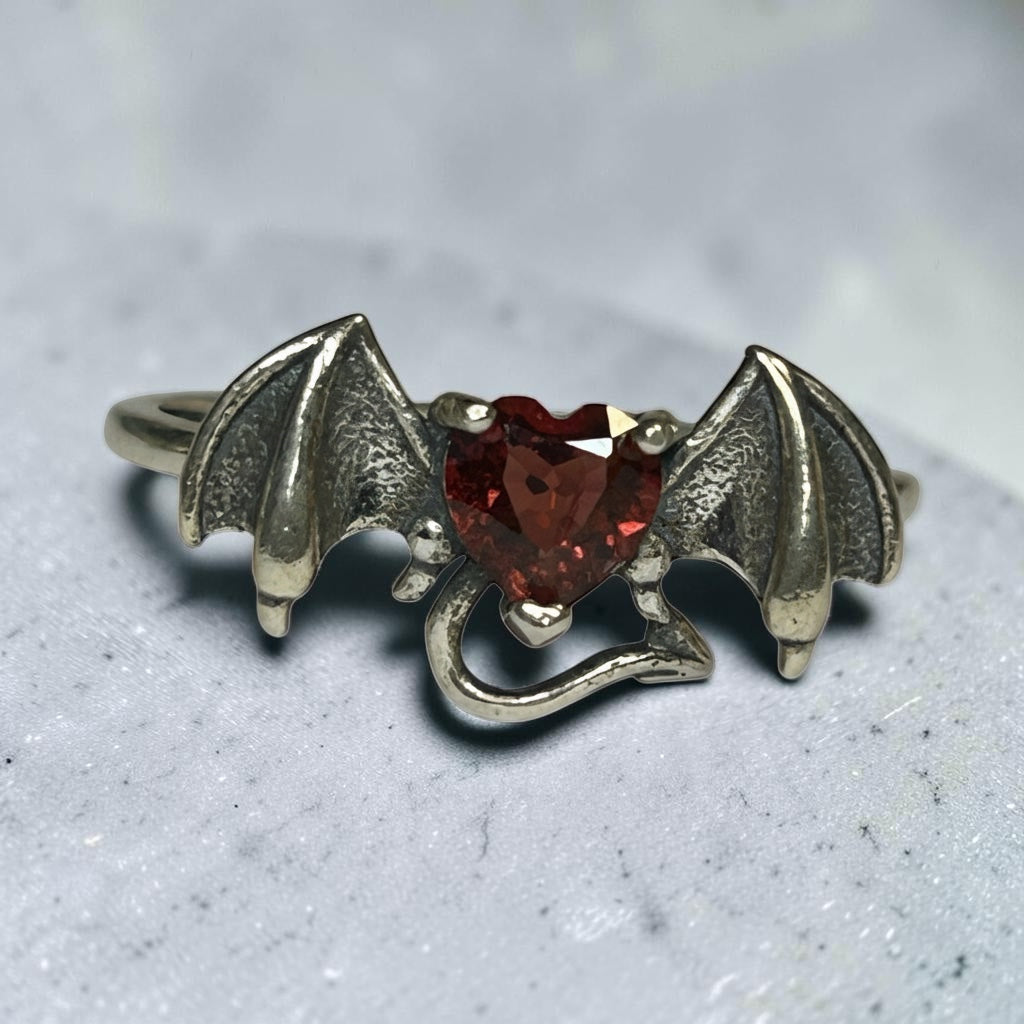 Celtic Dragon Jewellery 925 sterling silver bat ring with heart-shaped garnet gemstone and oxidised wings.