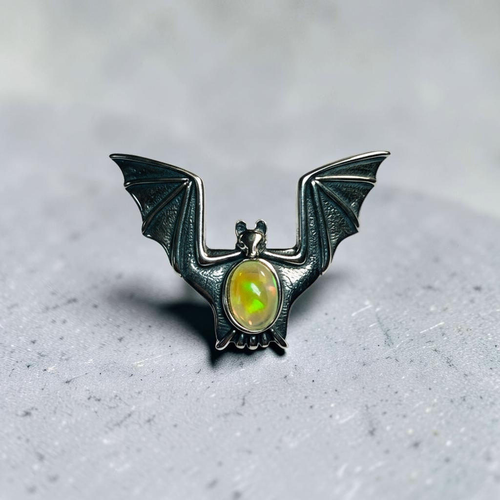 Celtic Dragon Jewellery adjustable 925 silver bat ring with rainbow opal gemstone.