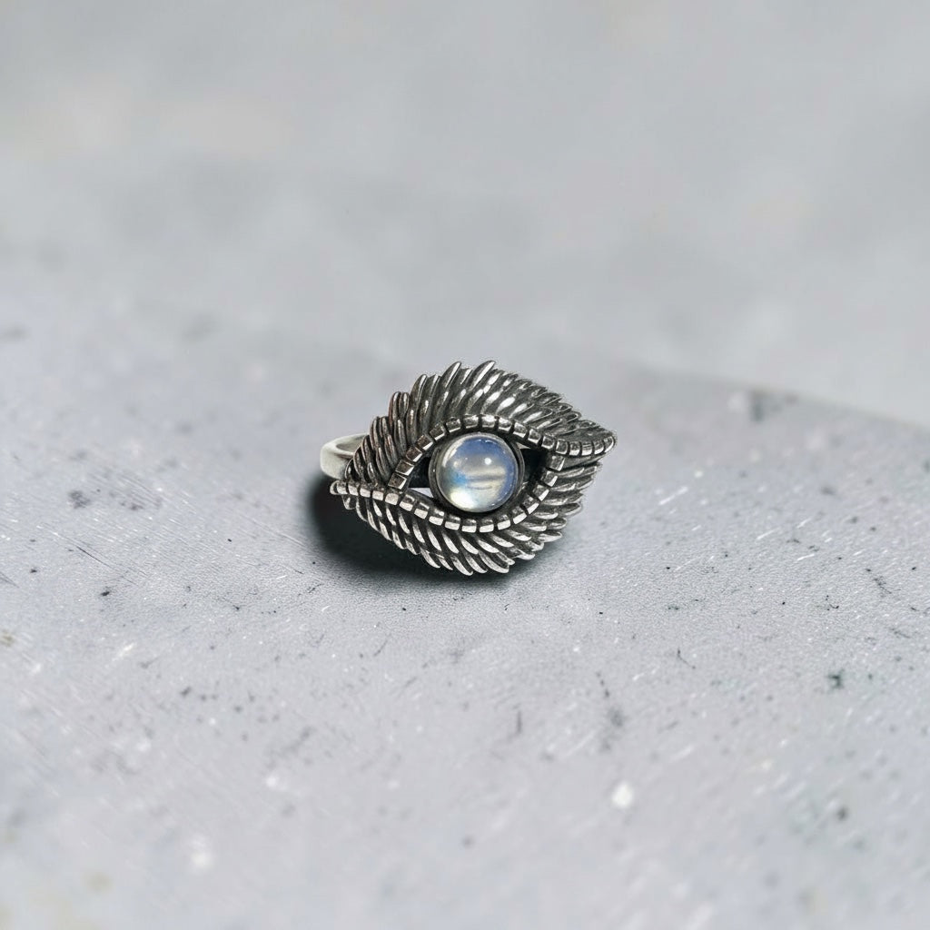 Celtic Dragon Jewellery silver adjustable ring with evil eye design and blue flash moonstone.
