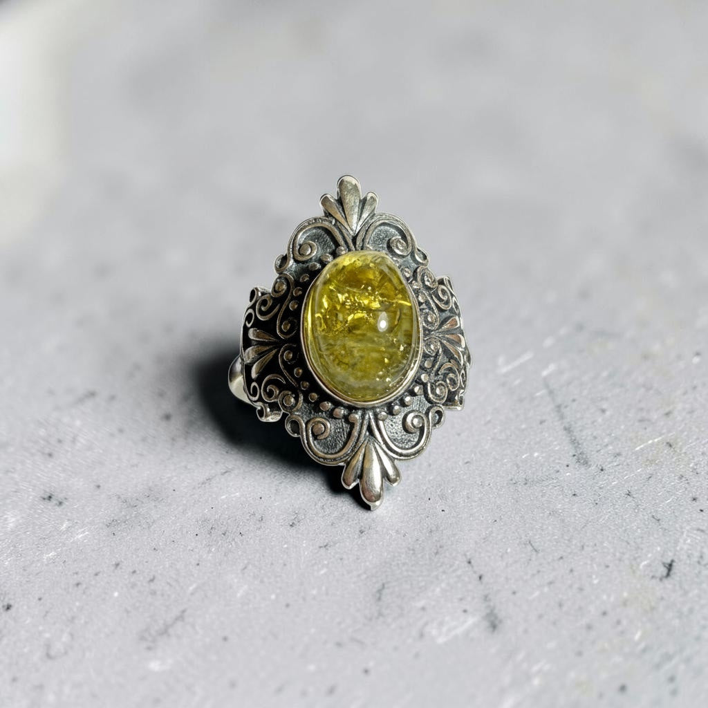 Celtic Dragon Jewellery ornate 925 silver adjustable ring with oval green tsavorite gemstone.