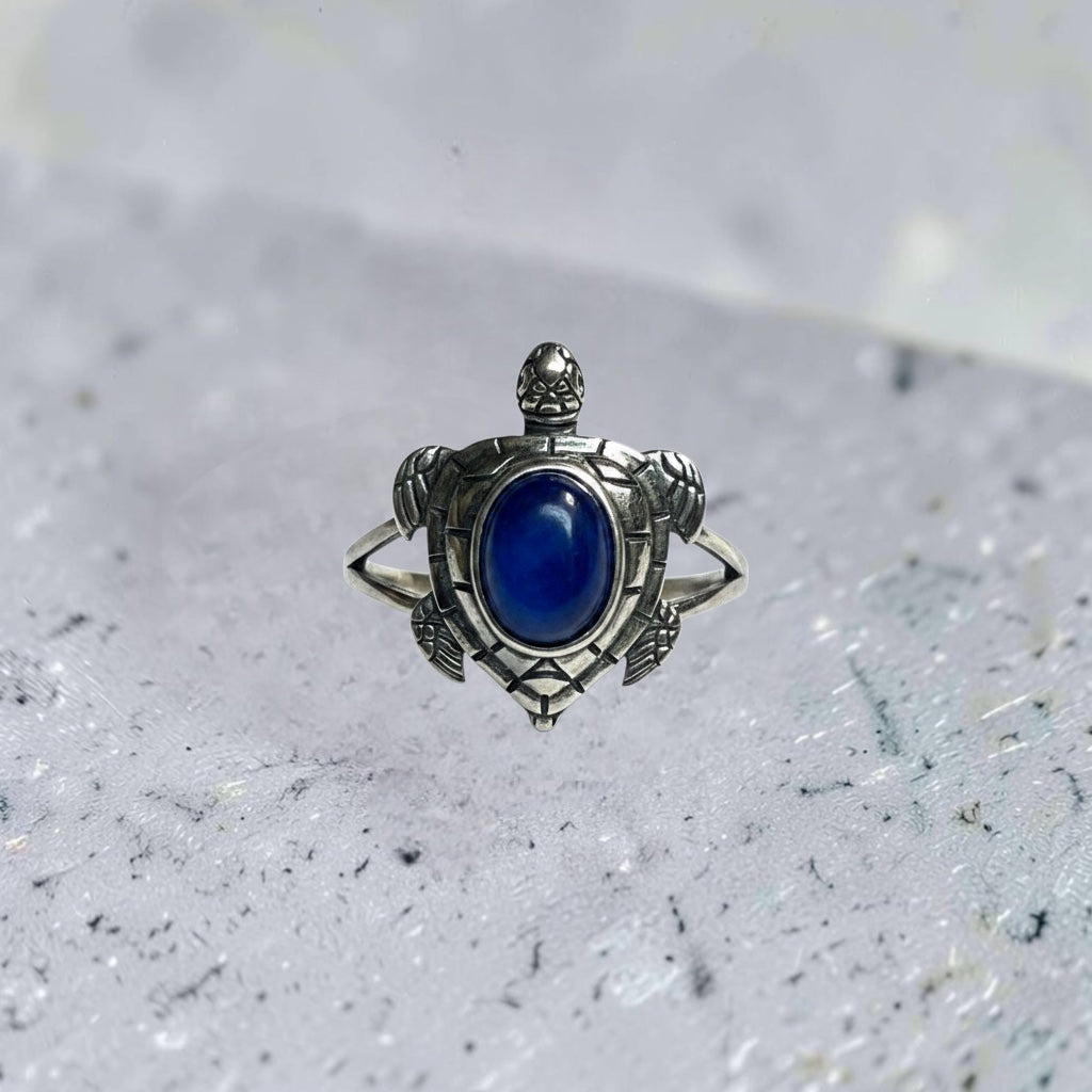 Celtic Dragon Jewellery adjustable 925 silver ring with ornate turtle design and oval blue kyanite gemstone.